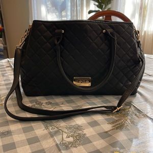 Bebe black quilted black satchel with gold hardware & a crossbody strap